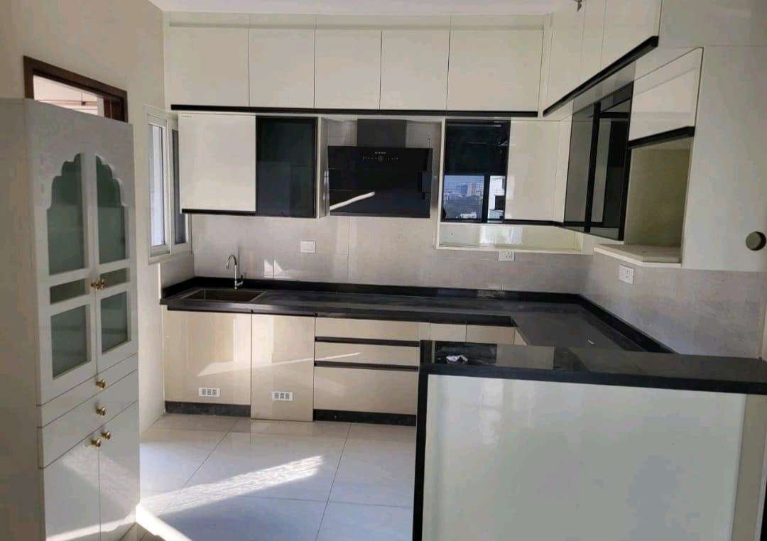L-Shaped Kitchen in Graphite & Ivory — Residential project by AV Engineering & Interiors