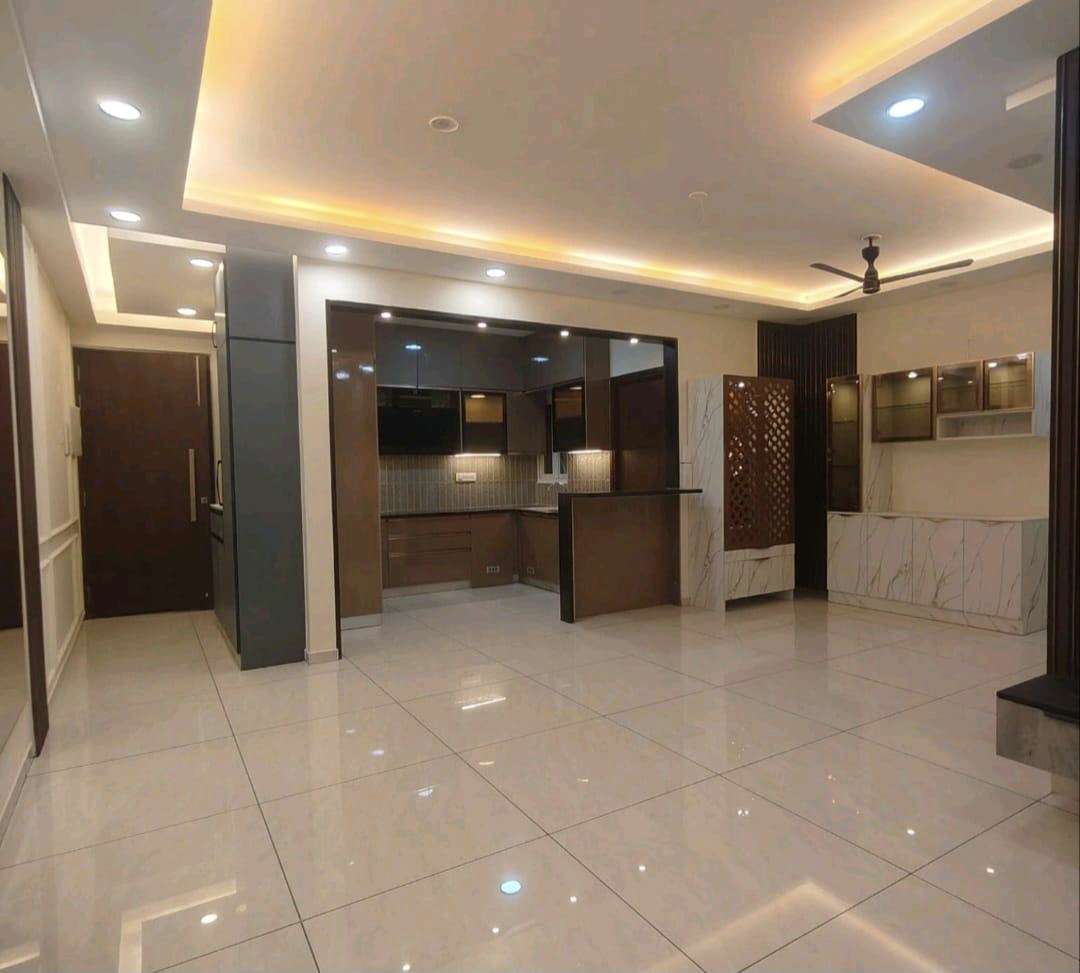 Living area with layered cove ceiling completed by AV Engineering & Interiors
